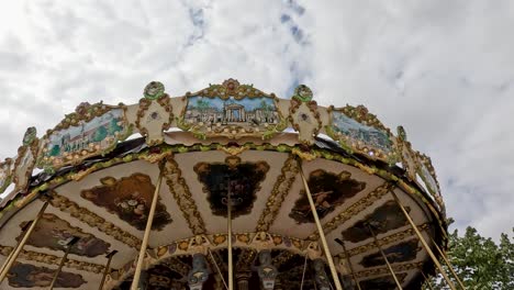 a vibrant carousel spinning under cloudy skies