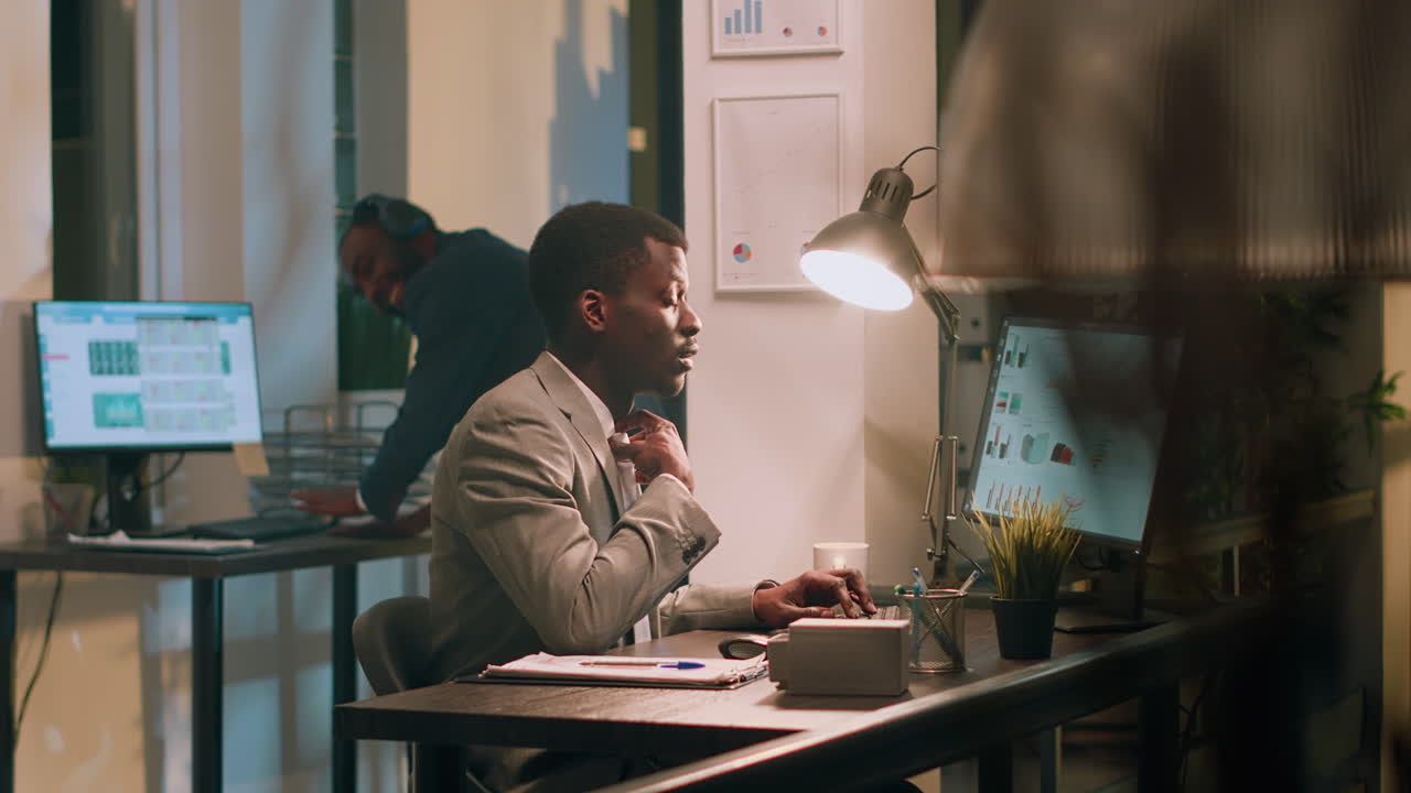 Businessmen working late in the office