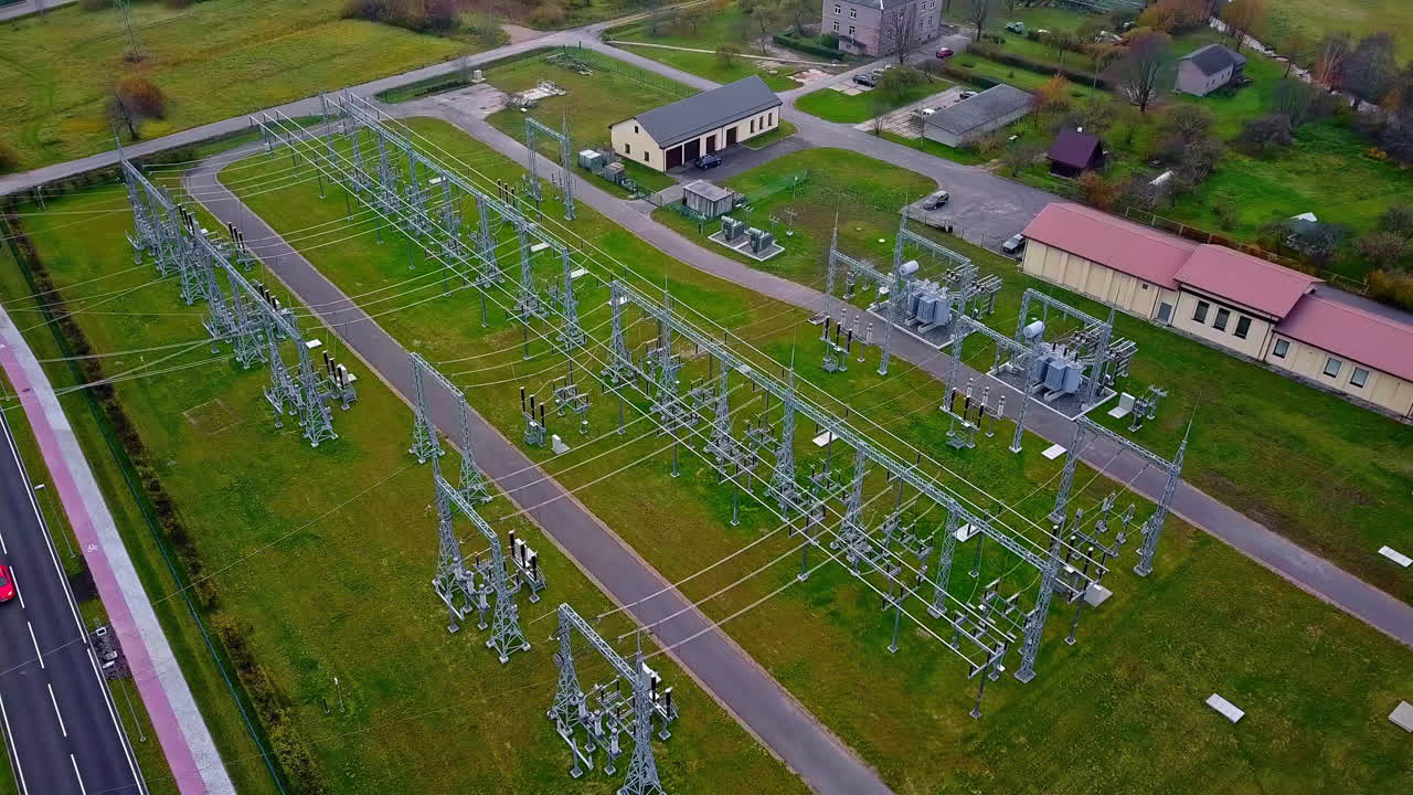 Drone aerial view of a electric power plant in a green environment in Northern Europe