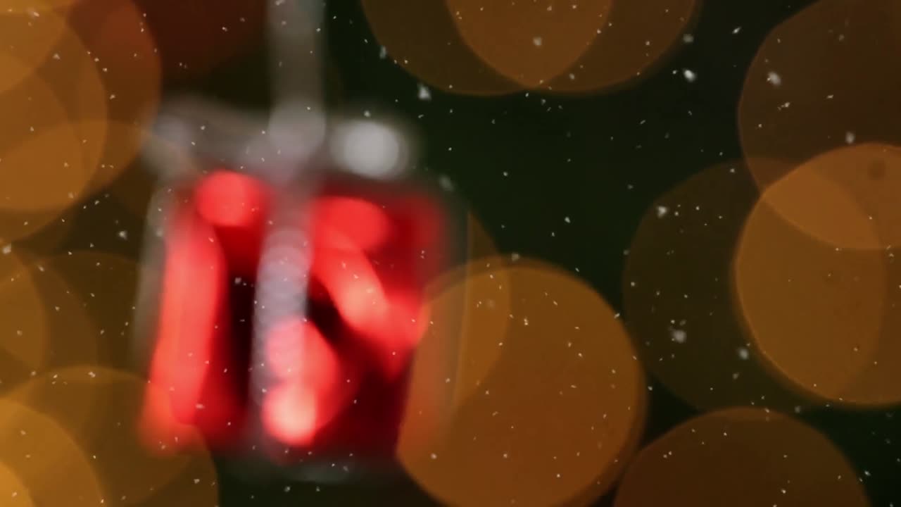 Animation of snow over present decoration