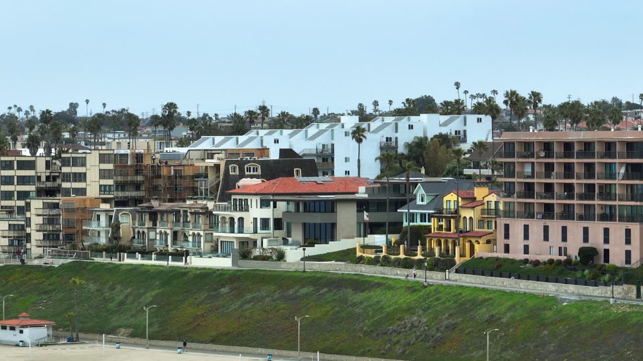 Telephoto drone shot of seaside homes at the Redondo beach, in Los Angeles, USA