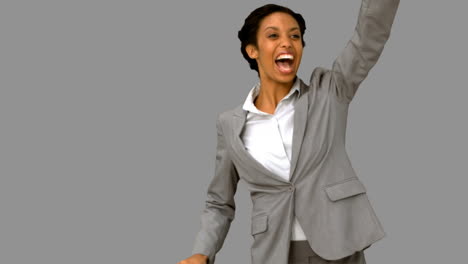 Cheerful-woman-waving-at-someone-on-grey-screen