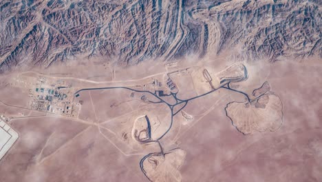 flying over the earth on the iss. flying over desert, aerial view from space.