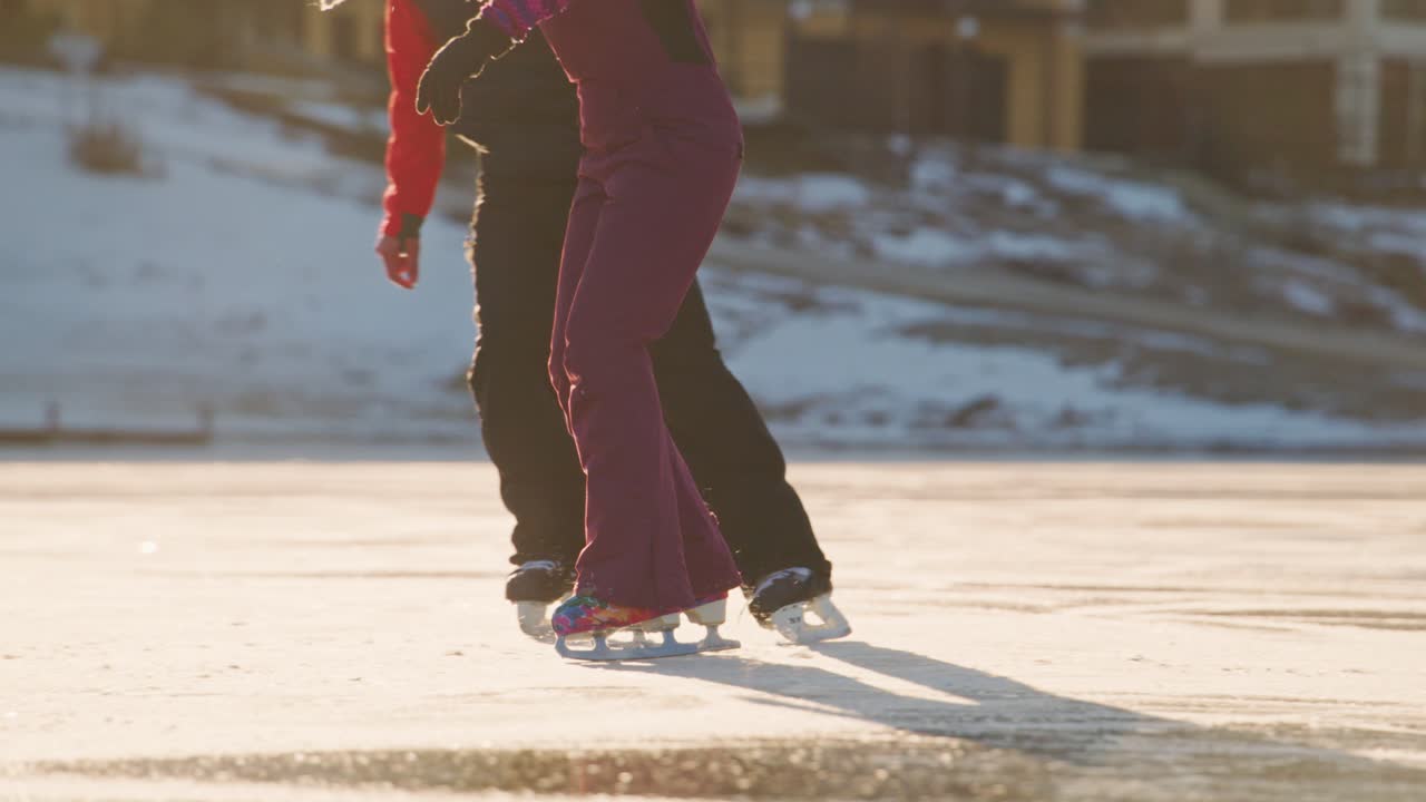 Couple Ice Skating on a Frozen Lake in Winter