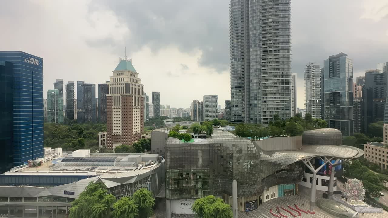 Time lapse overlooking the city center of SIngapore with the iconic ION mall and The Orchard Residences