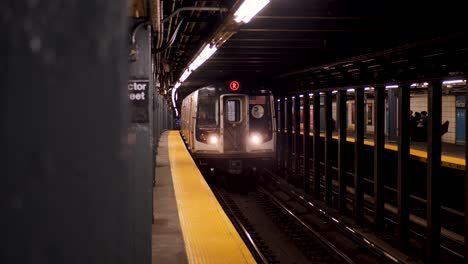 slow motion of subway train coming through station tunnel platform along railway tracks in rector street new york city manhattan underground usa america travel transport metro system
