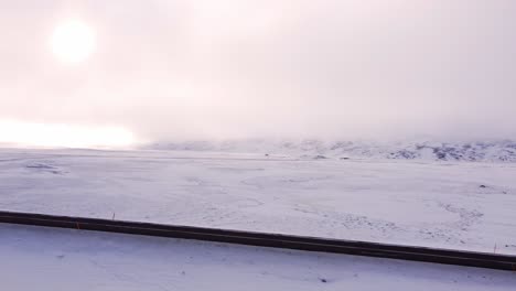 a sweeping aerial perspective showcases an expansive, pristine snow-covered wilderness stretching to the horizon in north iceland