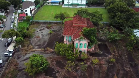 aerial drone shot of an old and abandoned house in penang, malaysia