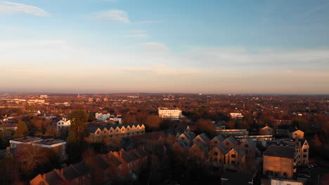 aerial dolly in: drone flies over the sleepy town crystal palace in london england