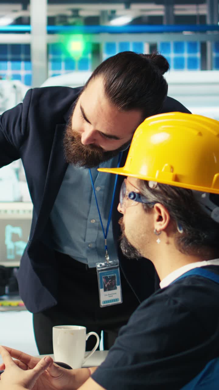 Vertical Video Solar Panel Plant Manager Showing Engineer How To Develop Prototypes
