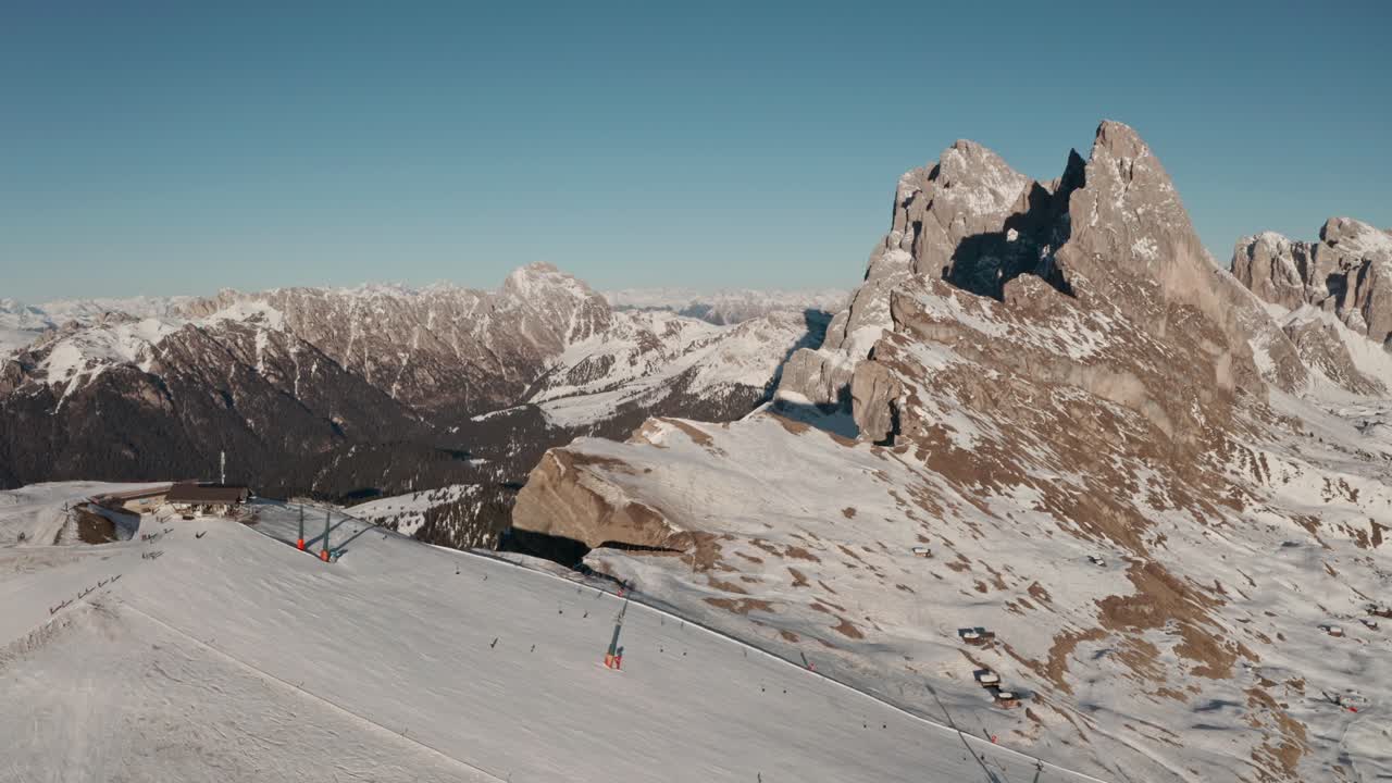 Slider drone shot over Seceda ski slope italian dolomites