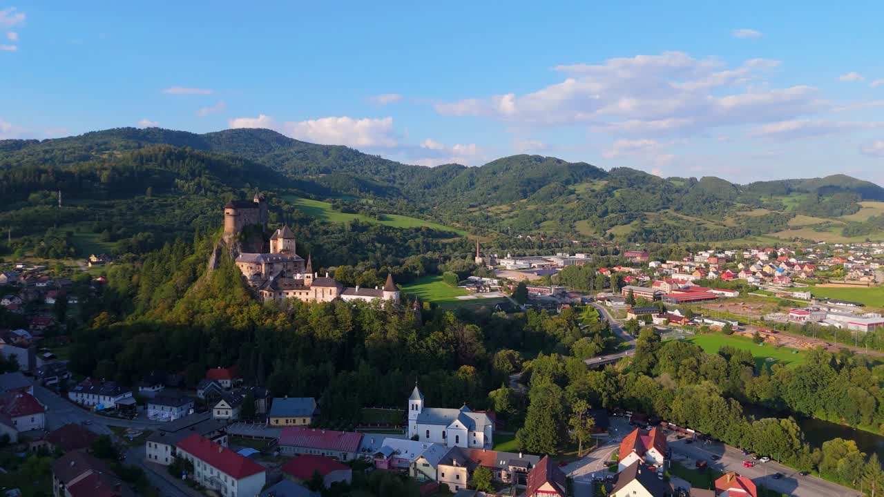 Scenic European Village with Castle and Mountain Backdrop