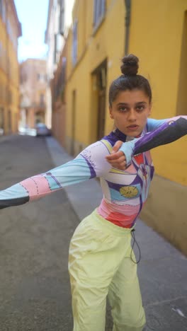 stylish woman dancing in a city street