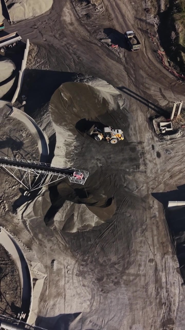 View of a busy quarry site with equipment and materials in operation