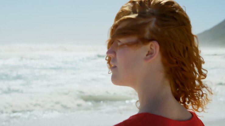 Woman looking at beautiful ocean 4k
