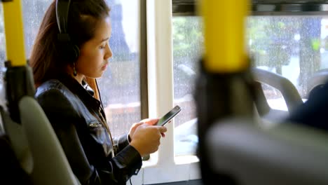 teenager girl listening to music on headphones 4k