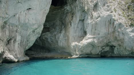 Beautiful-view-of-the-White-Grotto-in-Capri,-in-Italy,-during-a-sunny-morning-in-summer-with-very-clear-and-transparent-water