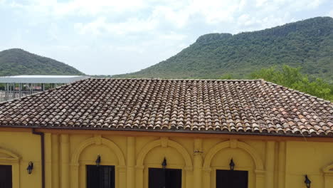 Railway-station-museum,-drone-shot,-behind-you-can-see-the-hills-from-Paraguari