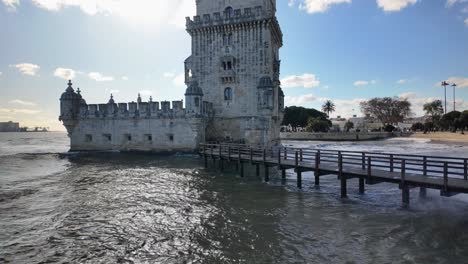 belém tower with waves in lisbon
