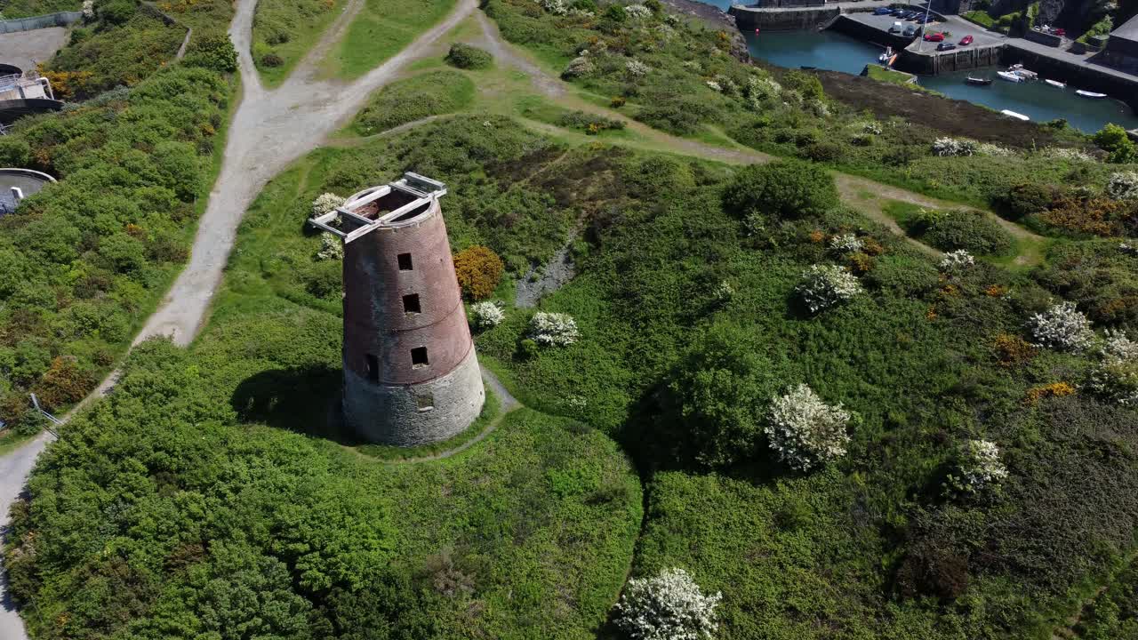 Amlwch port red brick disused abandoned windmill coastal aerial view North Anglesey Wales