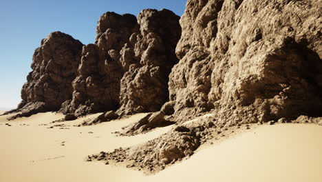 stunning view of a desert landscape with rock formations and sand dunes