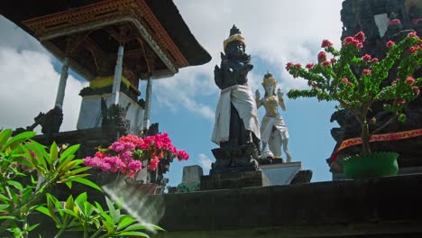 hindu stone statues in white clothes and flesh