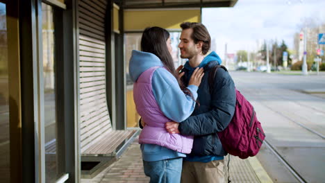 couple at bus stop