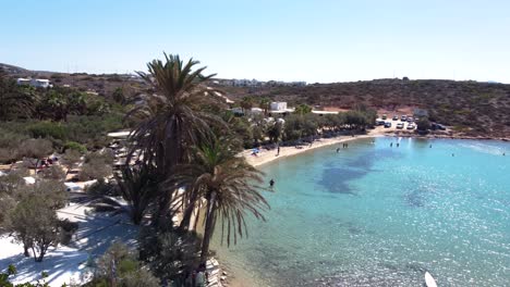 aerial revealing orbit view over idyllic agia irini beach, paros