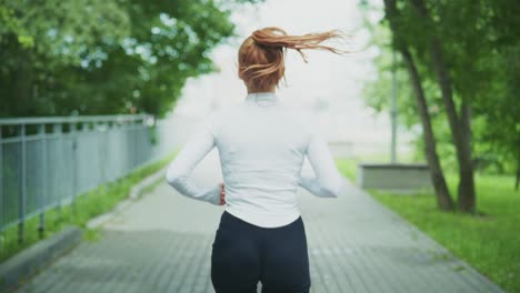 woman running outdoors in a park