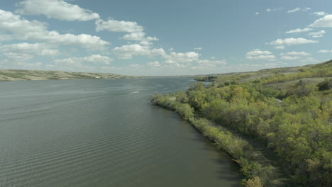 vast lake with country road on buffalo pound provincial park in saskatchewan, canada