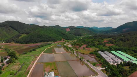 high altitude aerial landscape view and road tracking in country side