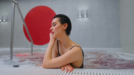 woman relaxing in a modern spa hot tub
