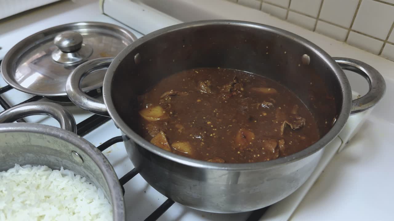 Mexican beef stew simmered in a rich morita chili sauce and tender potatoes. Boiling on the stove
