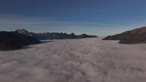 aerial - cloud covered walensee valley surrounded by mountain peaks in switzerland