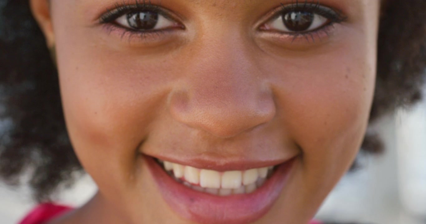 Close-up Portrait of a Smiling Young Woman