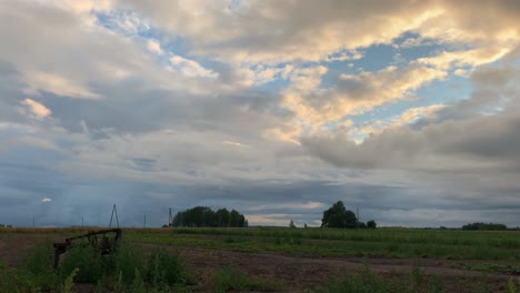 glorious scenery of clouds over agricultural field in latvia - time lapse