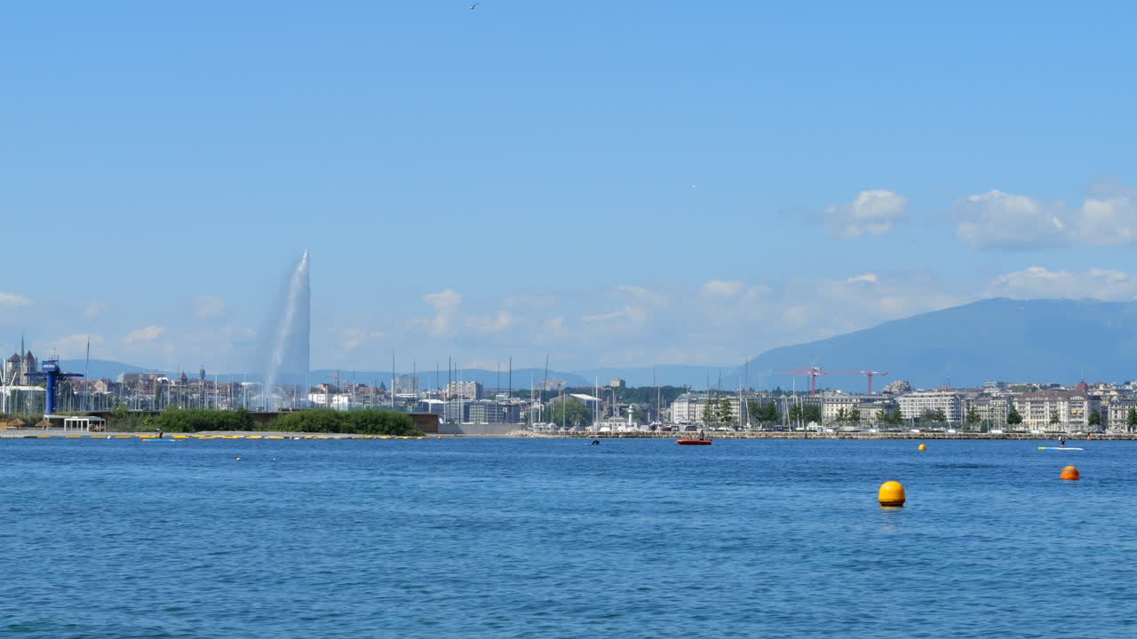 Jet d'Eau Water Fountain and Geneva Lake and City Skyline STATIC