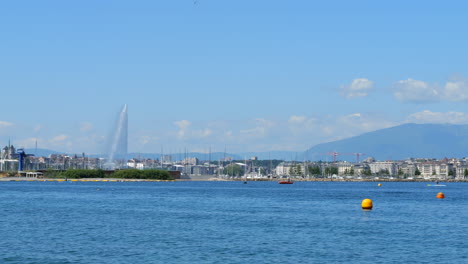 jet d'eau water fountain and geneva lake and city skyline static