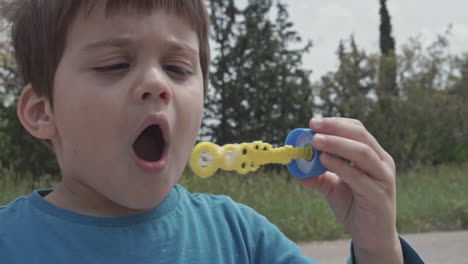 Kid-Plays-with-a-bubble-blowing-toy-60fps