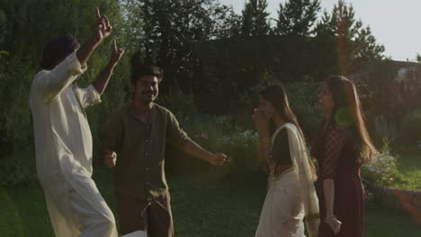 joyful group dancing and celebrating outdoors