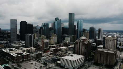 Drone-shot-soaring-towards-the-Houston,-Texas-downtown-district