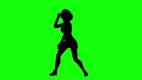 silhouette of a woman with afro hair and short skirt dancing loop 1, on green screen, front view