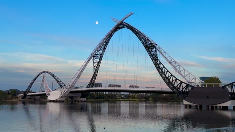 Moon-and-Matagarup-Bridge---wide-shot---Perth,-Western-Australia-with-blue-sky