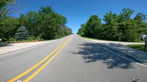 pov - driving on a rural country road with cable barriers