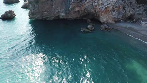 Cove-beach-green-water-rocks