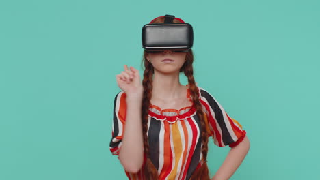 Child-girl-in-helmet-play-simulation-realistic-game-presses-imaginary-buttons-virtual-reality-video