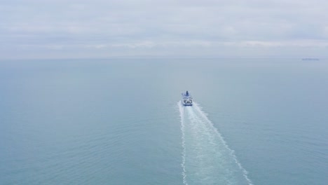 Aerial-follow-shot-of-Dover-to-Calais-cross-channel-ferry-in-calm-sea