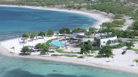 Luxury-resort-structure-with-swimming-pool-on-Puntarena-beach,-Bani-in-Dominican-Republic