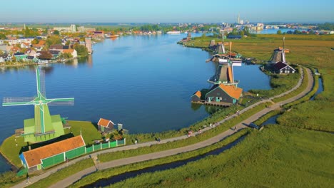 Windmills-on-river-Zaanse-Schans-in-Netherlands---Aerial-drone-footage-of-still-windmills-in-Zaanse-Schans,-Netherlands