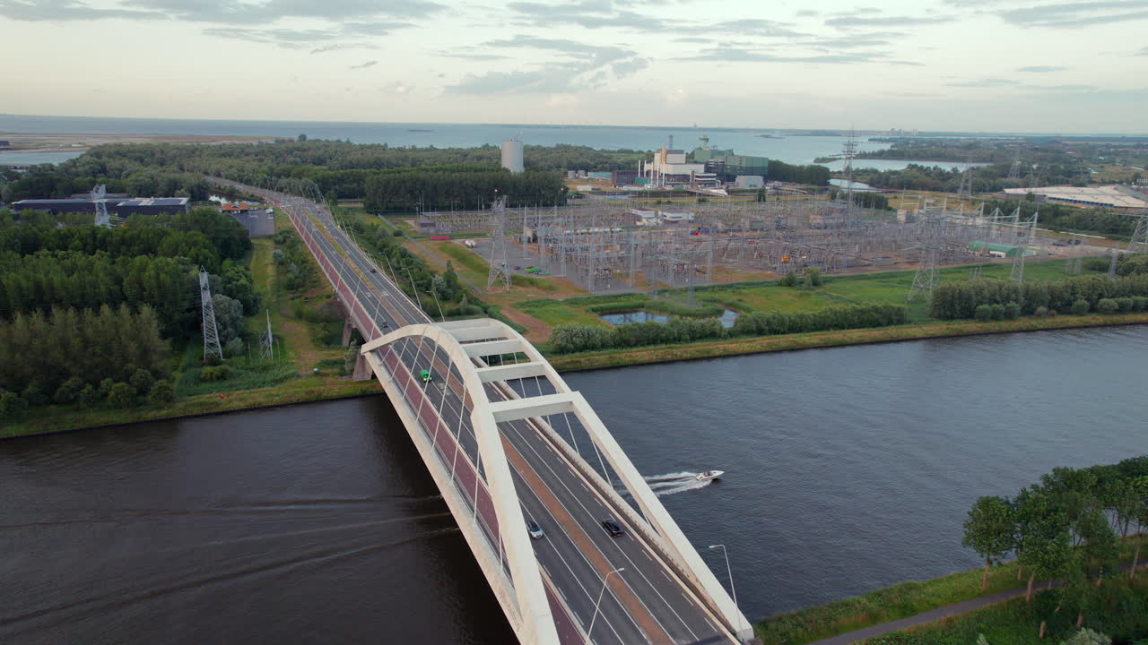 Uyllander Bridge Crossing Amsterdam-Rhine Canal In Diemen, Amsterdam, Netherlands. aerial sideways shot